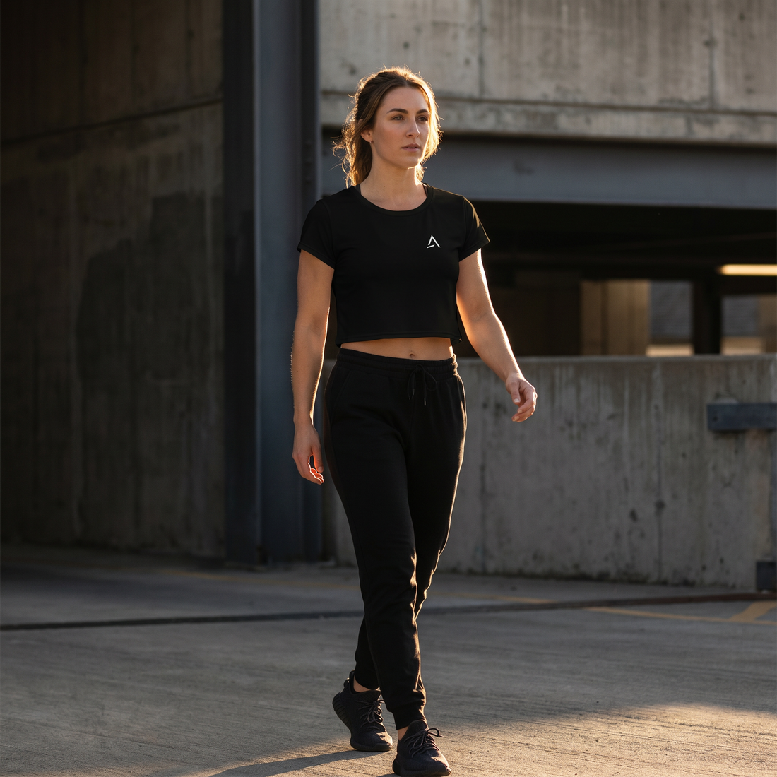 Female model wearing the Self Made Club All-Over Print Crop Tee