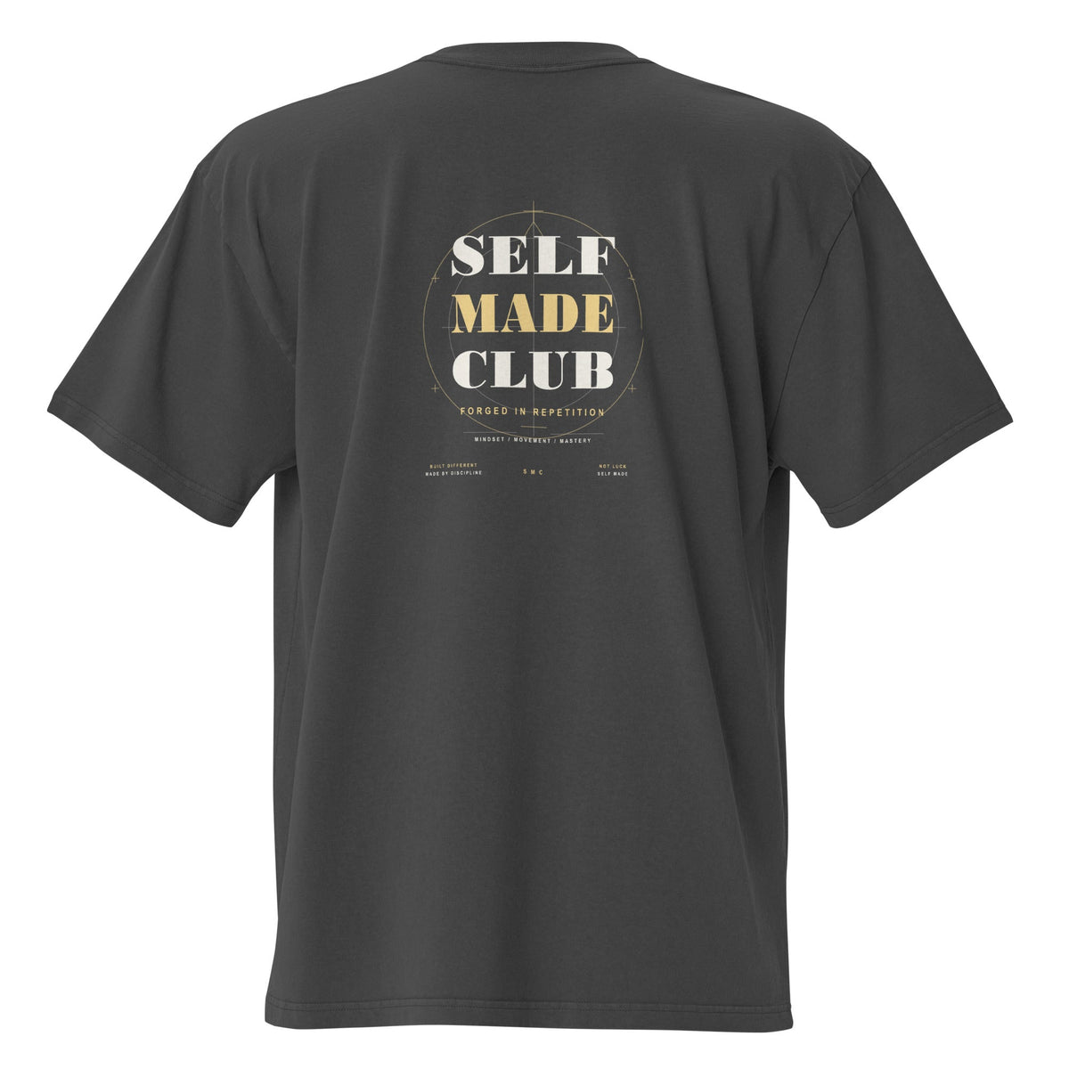 Self Made Club Forged in Repetition Tee in faded black — back view with oversized statement graphic