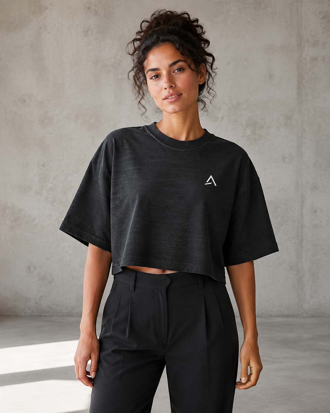 Self Made Club Washed Form Crop in black on a female model in front view, showing left chest mark, washed black cotton and oversized cropped fit. AI-generated styling visualization.