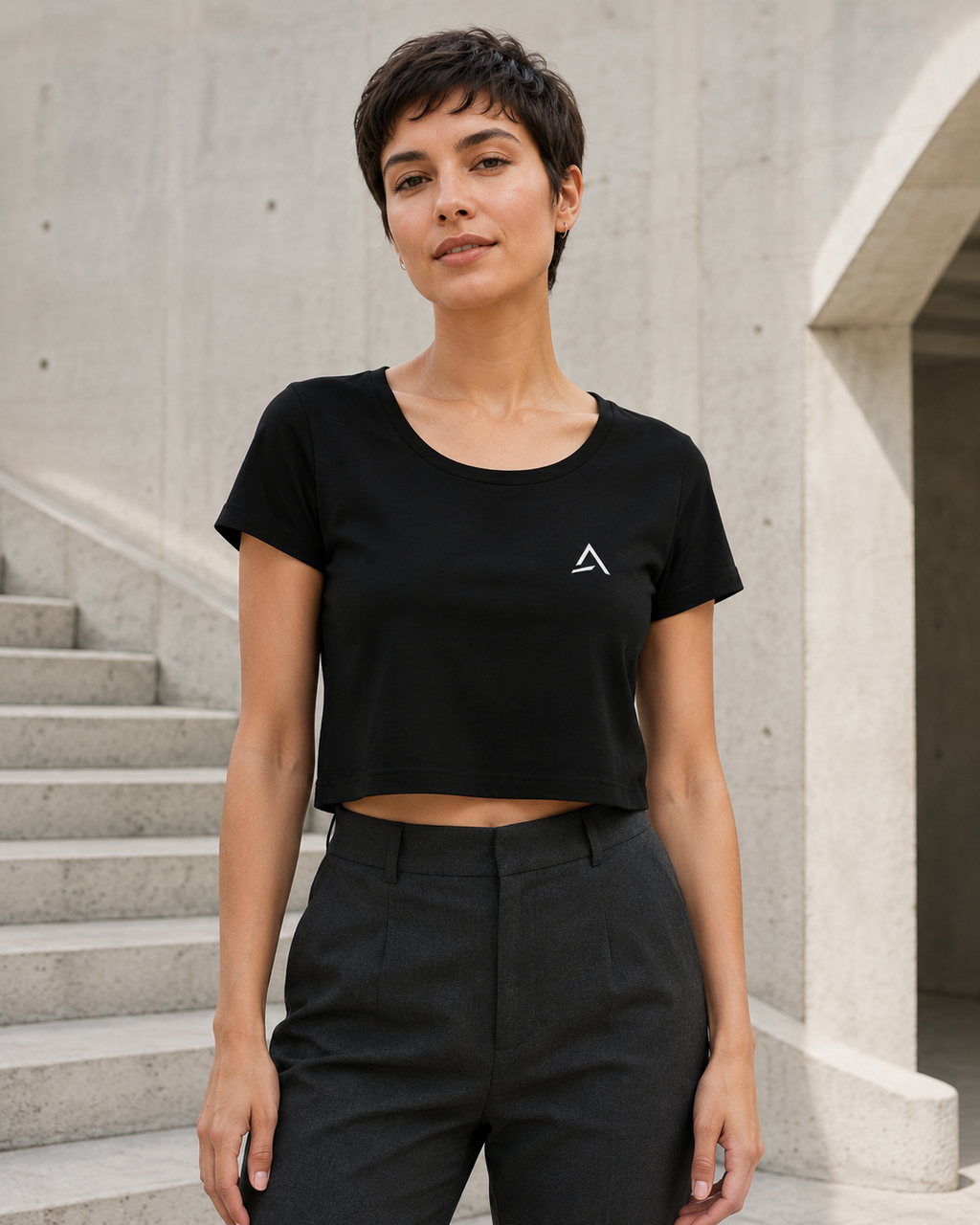 Self Made Club Crop Tee in black with a small white chest mark on an alternate female model, full untucked front view. AI-generated styling visualization.