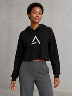 Self Made Club Form Crop Hoodie in black on a different female model in three-quarter view, showing center chest mark, raw cropped hem and relaxed fit. AI-generated styling visualization.