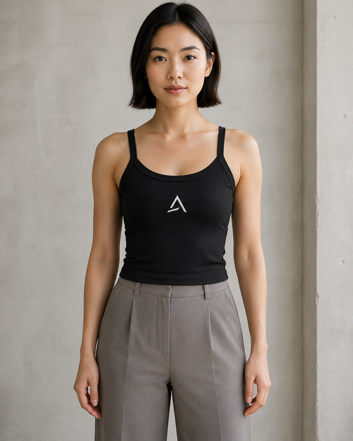 Self Made Club Form Rib Tank in black on a female model, showing narrow flat straps, scoop neckline, micro-rib fabric and centered embroidered mark. AI-generated styling visualization.