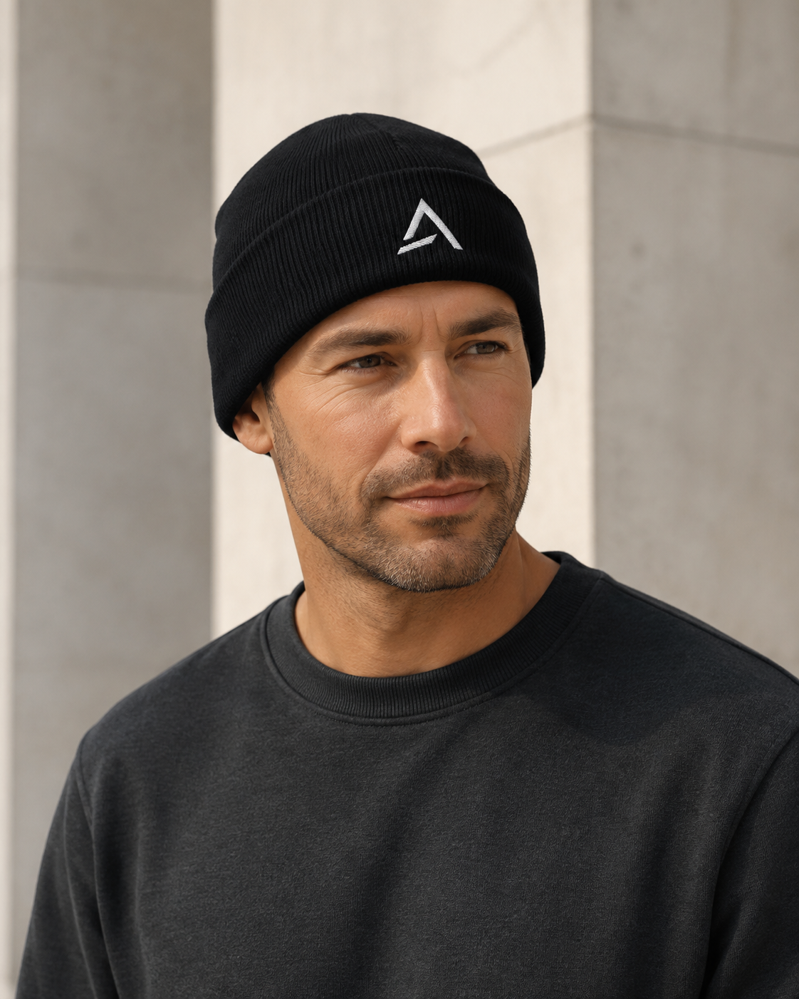 Self Made Club Standard Issue Beanie in black on an alternate male model, three-quarter portrait with cuff and embroidery visible. AI-generated styling visualization.
