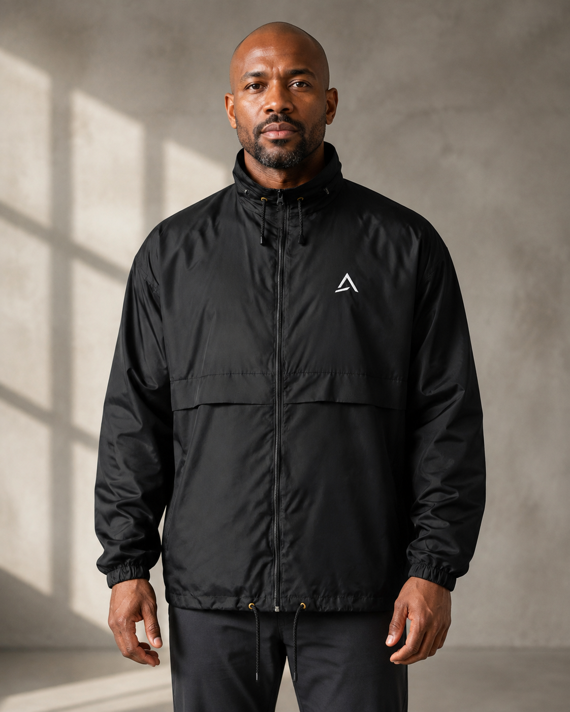 Self Made Club Standard Issue Windbreaker in black on an alternate male model, full front fit in a studio. AI-generated styling visualization.