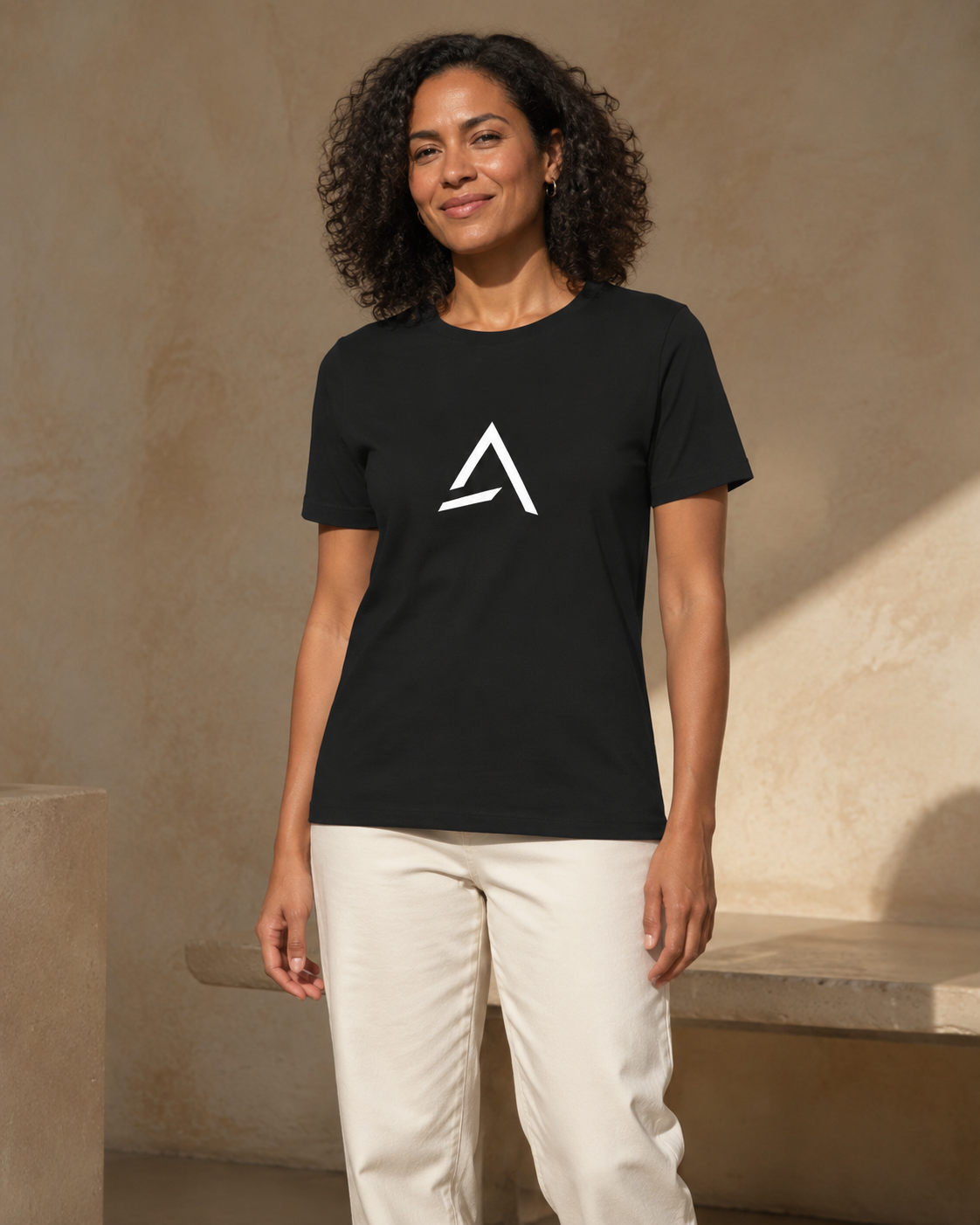 Self Made Club Women's Relaxed T-Shirt in black on an alternate female model, untucked front studio view. AI-generated styling visualization.